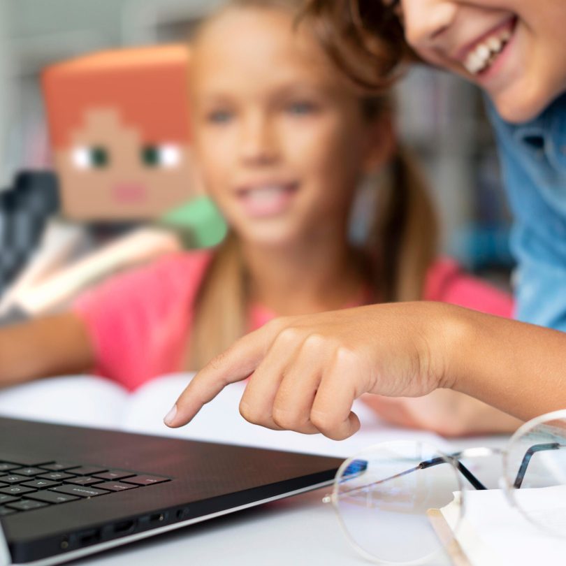kids-doing-their-homework-laptop-close-a